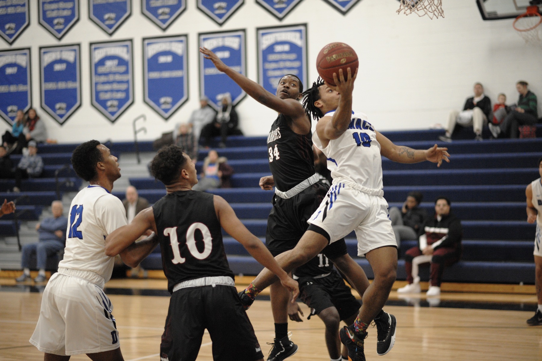 Ray Miller goes up for the scoop shot.