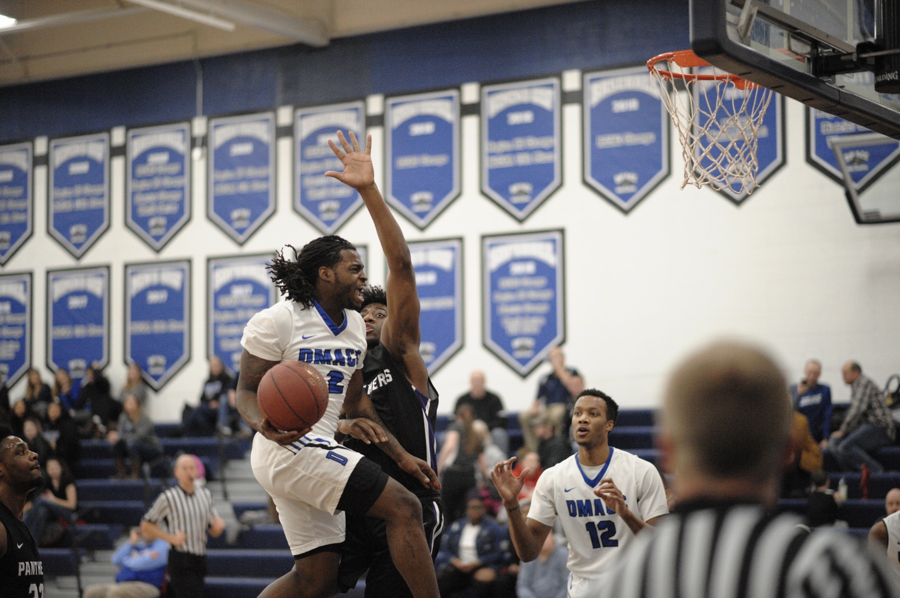 Tray Buchanan driving to the hoop