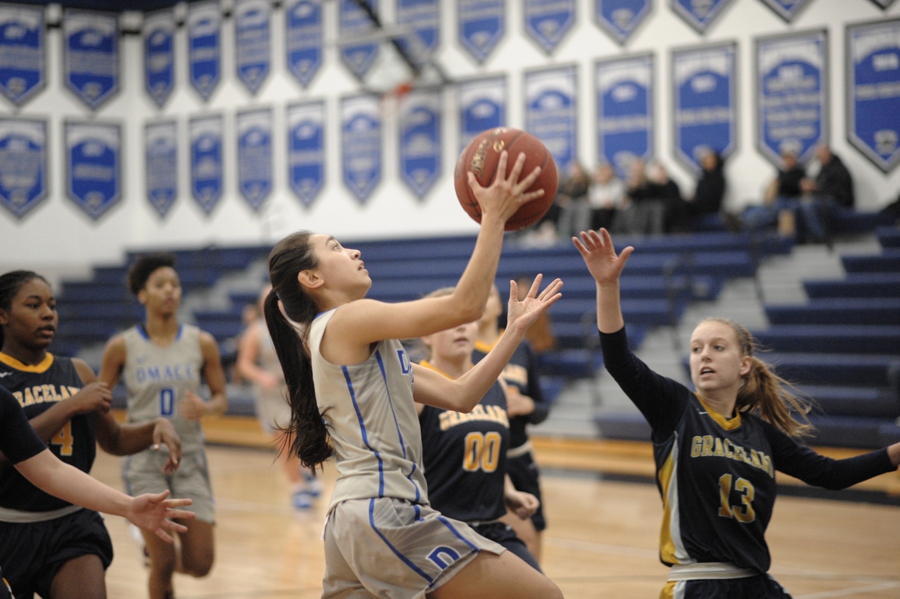 Asia Mena goes up for shot.
